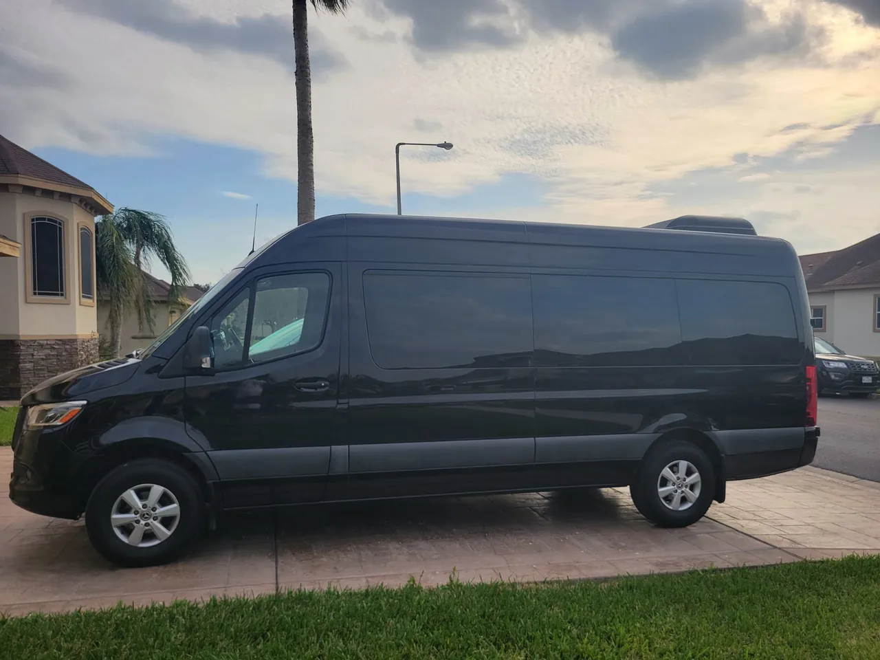 Black Mercedes-Benz Sprinter Passenger Van, angle 2 Black Mercedes-Benz Sprinter Passenger Van, angle 2